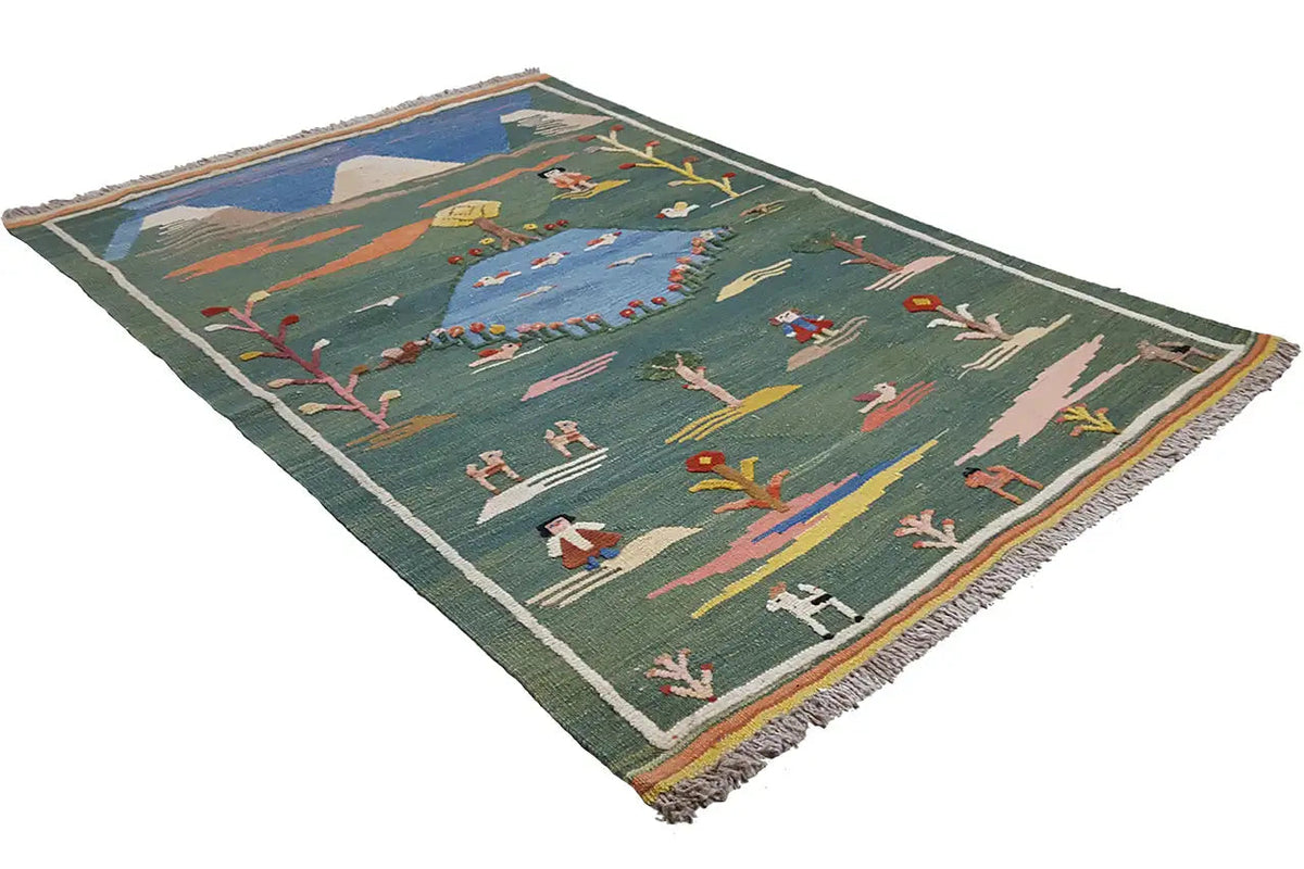 Green kilim rug with landscape motifs, diagonal view, fringed border all around