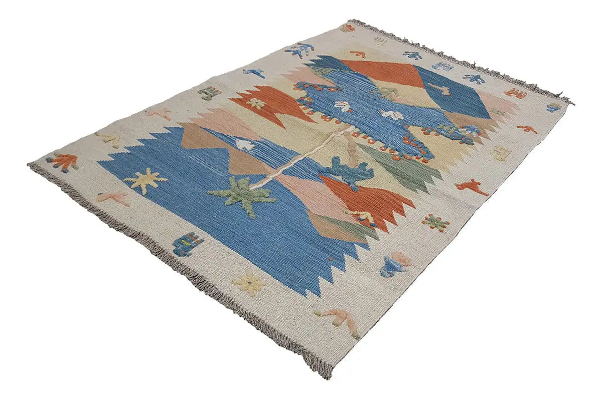 Kilim rug, diagonal view, cream with blue and orange triangles and ornaments