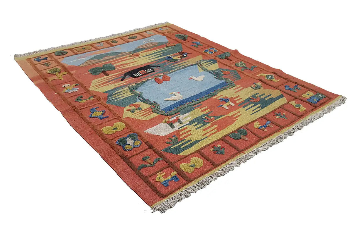 Kilim rug in brick red with a central landscape motif, multicolored border, and fringes