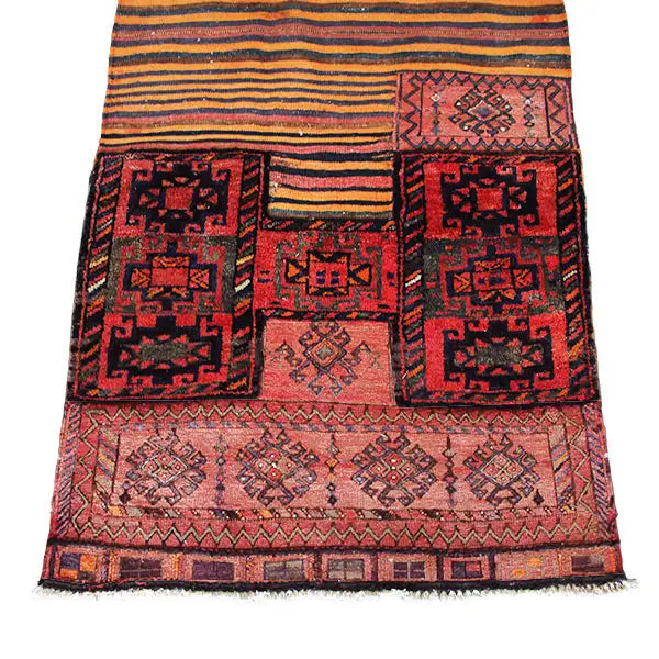 Kilim rug with a red, beige, and dark blue pattern and delicate fringes