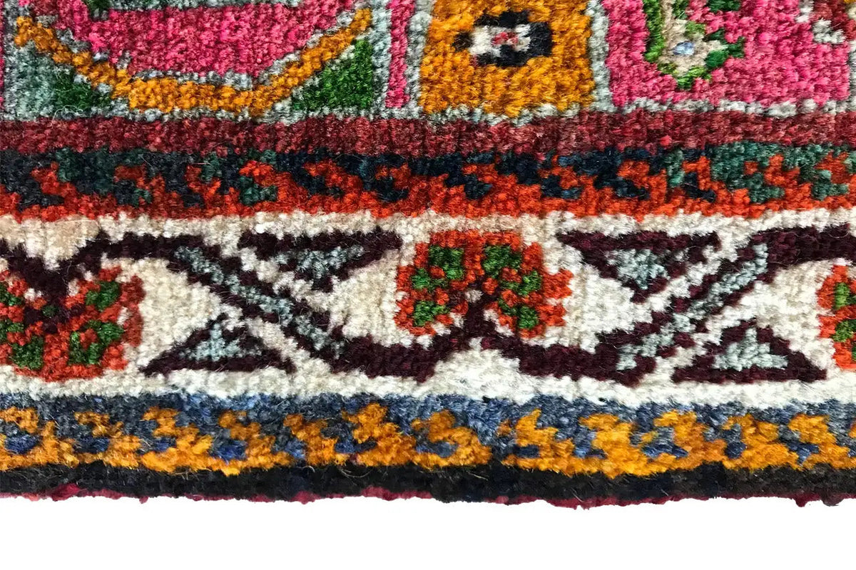 Carpet frieze with zigzag and diamond motifs in red, orange and green