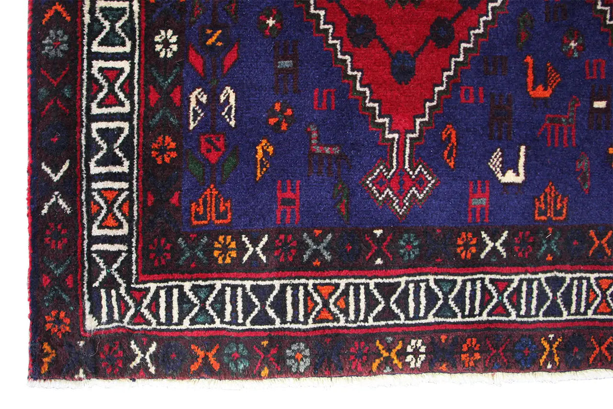 Rug with a border and geometric pattern in dark blue, red, and white