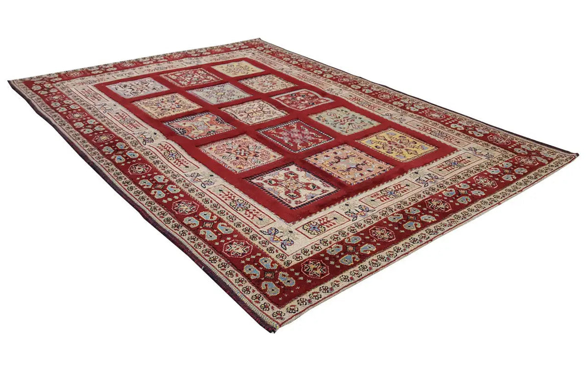Rug with a red background, cream-colored fields, and blue-red medallion-style vines