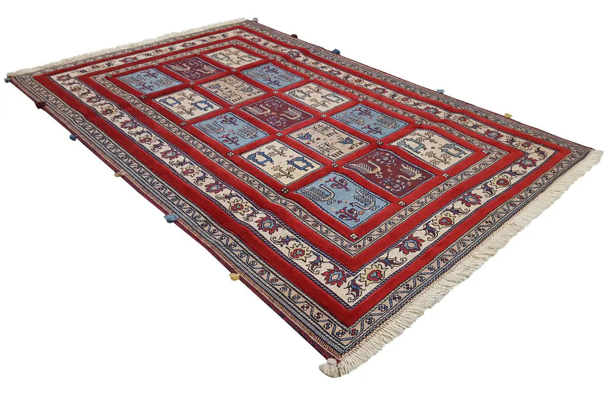 Rug 179x117 cm in a red pattern with blue lines and a surrounding border, fringes