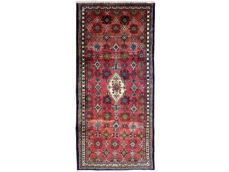 A beautiful hamedan rug in red color representing a medallion in the center. 