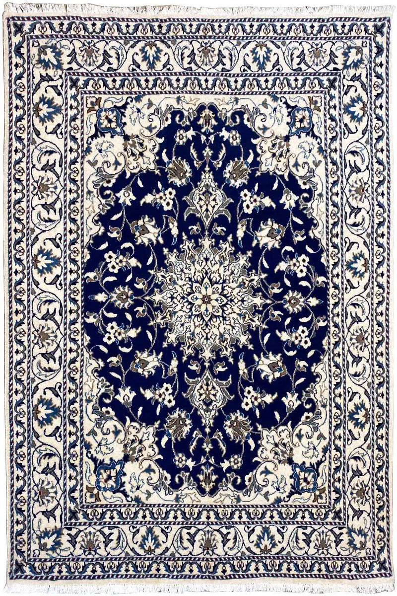 A beautiful nain teppich in Beige and Blue color representing a flower as a medallion. 
