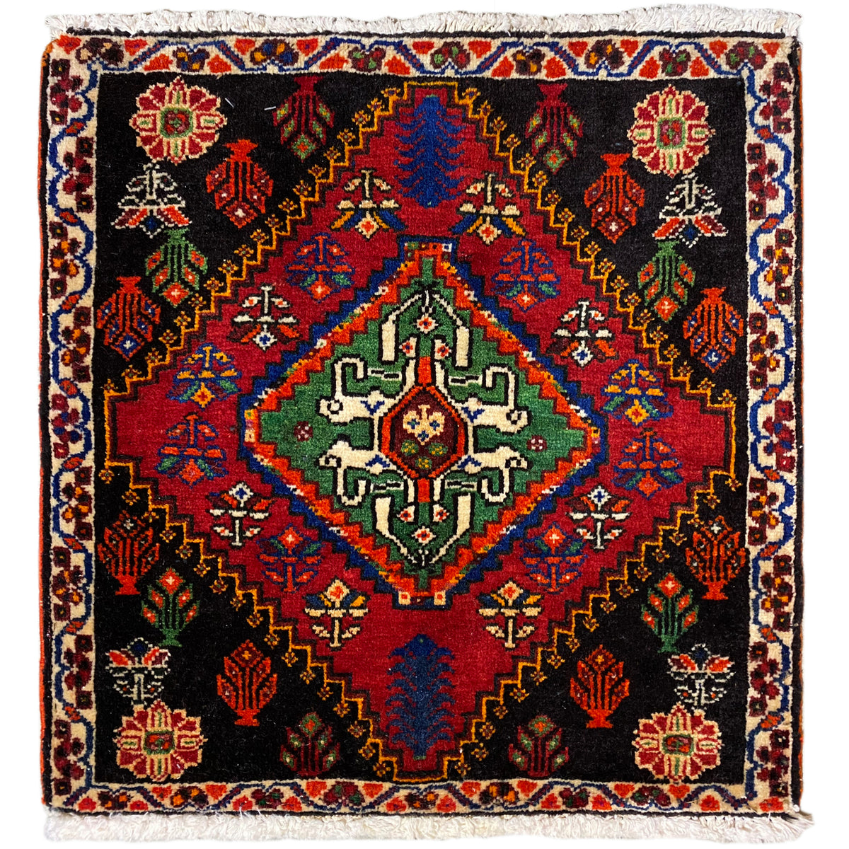 Poshti rug 56x56 cm with a black background, colorful ornaments, and decorative fringes