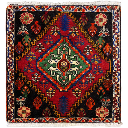 Poshti rug 56x56 cm with a black background, colorful ornaments, and decorative fringes