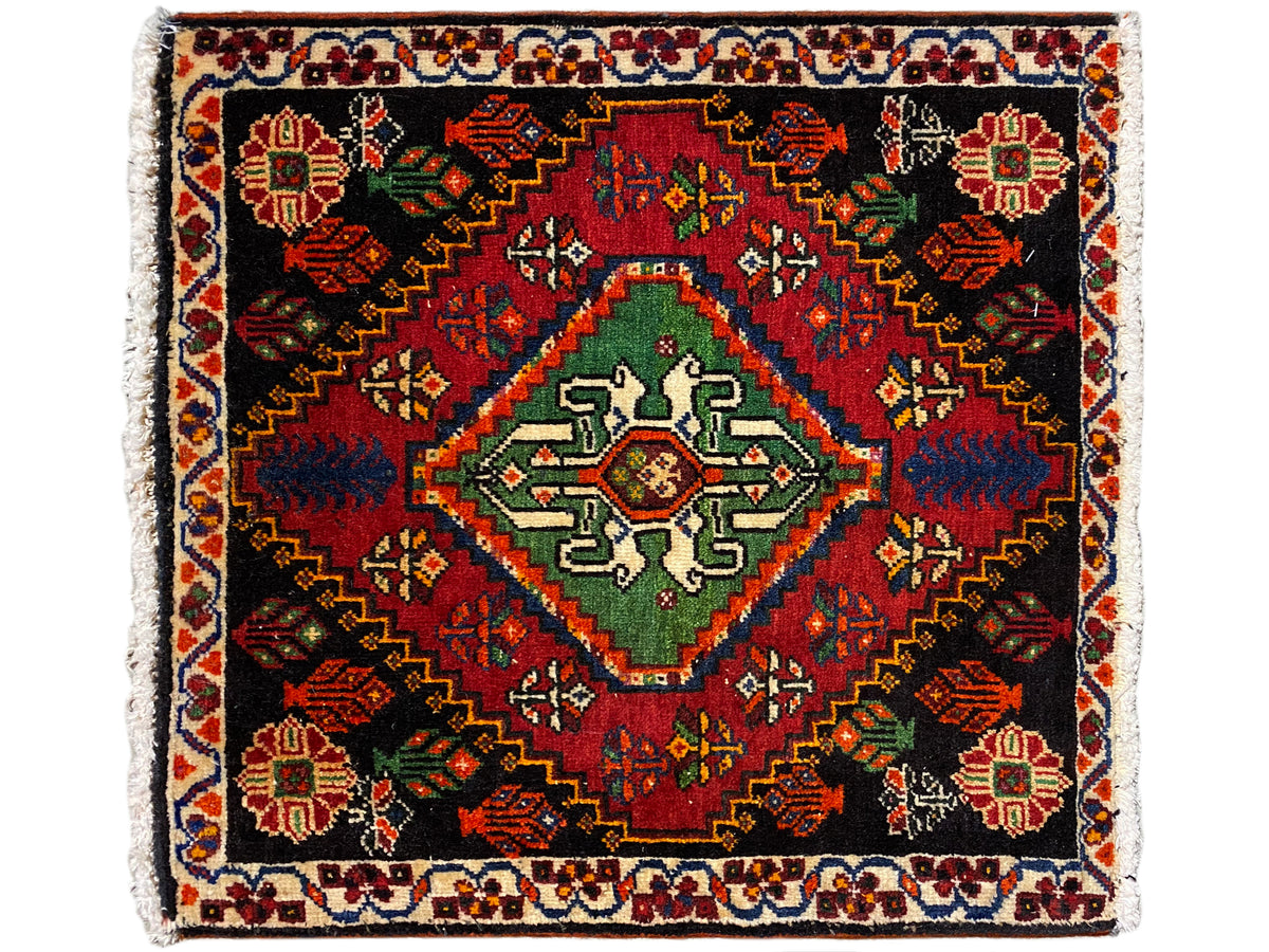Square Poshti rug with a black background, red/green/blue medallion and border