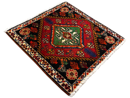 Poshti rug, square, diagonal: black rug with green medallion and colorful border