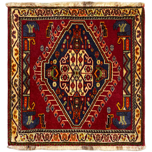 Poshti rug (59×61 cm) with a red all-over pattern, multicolored borders, and fringes