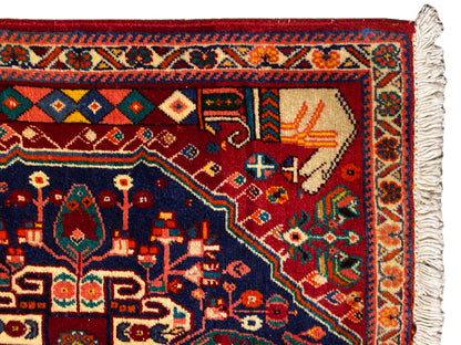 Poshti rug 64x64 cm, close-up of the edge area with geometric patterns, red-blue, tassels