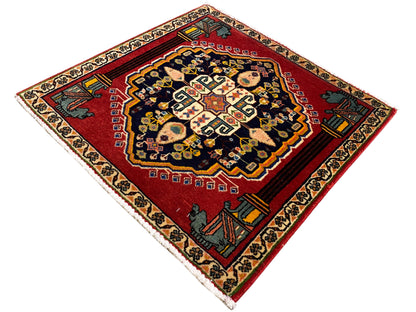 Poshti rug with a diamond pattern, red background, dark medallions and borders