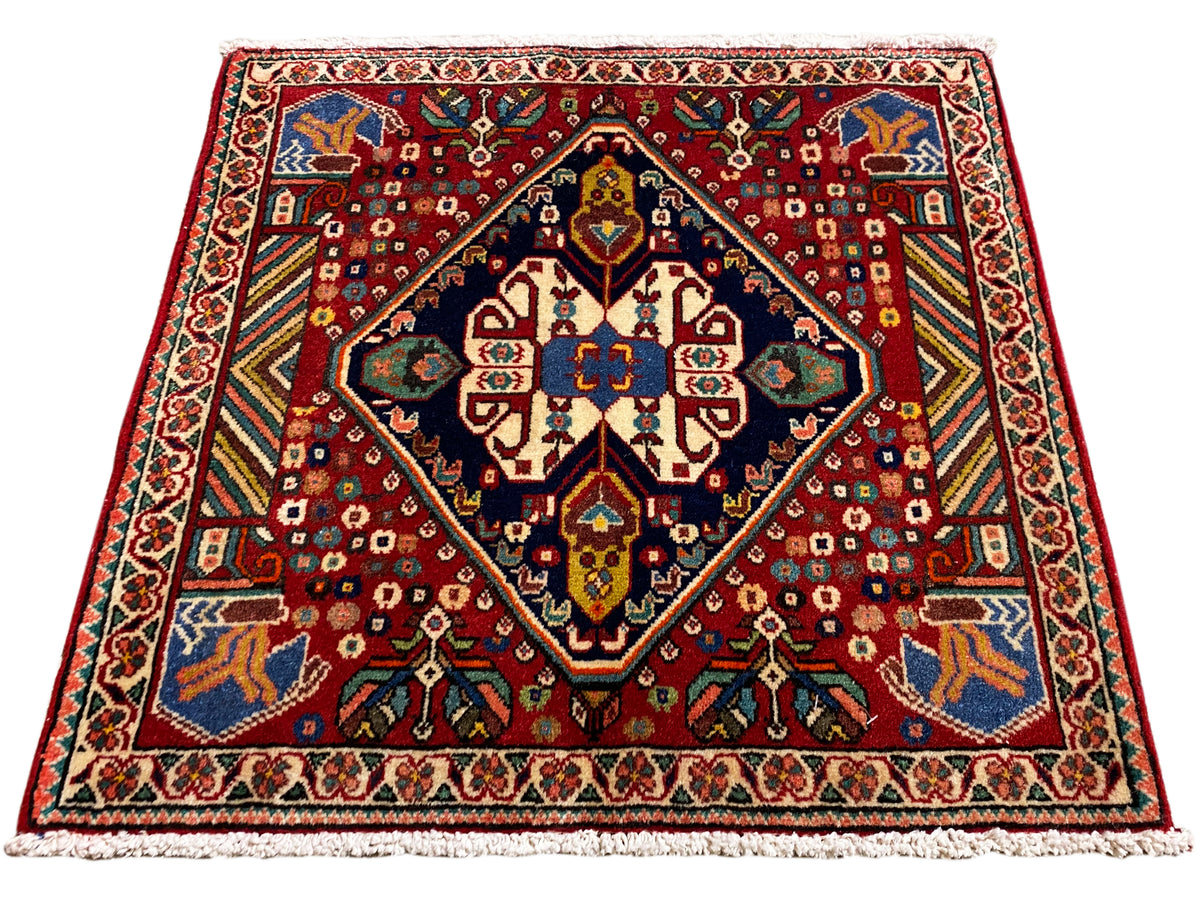 Carpet 66x62 cm with a red pattern, dark border, and colorful ornaments