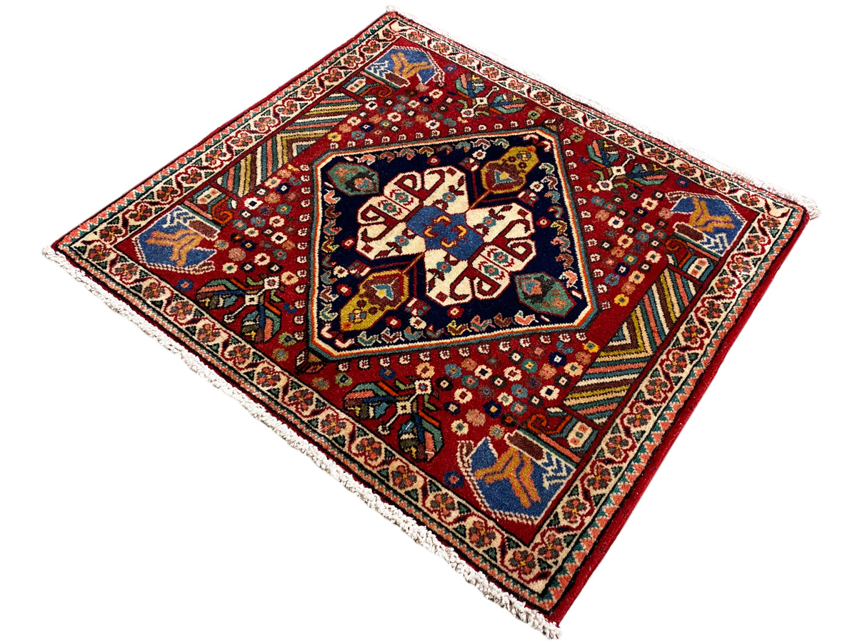 Rug 66x62 cm, red background with blue-green ornaments and a white border frieze