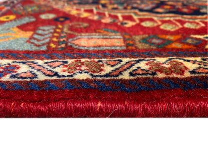 Carpet edge binding with dense pile, red base, and patterned stripe