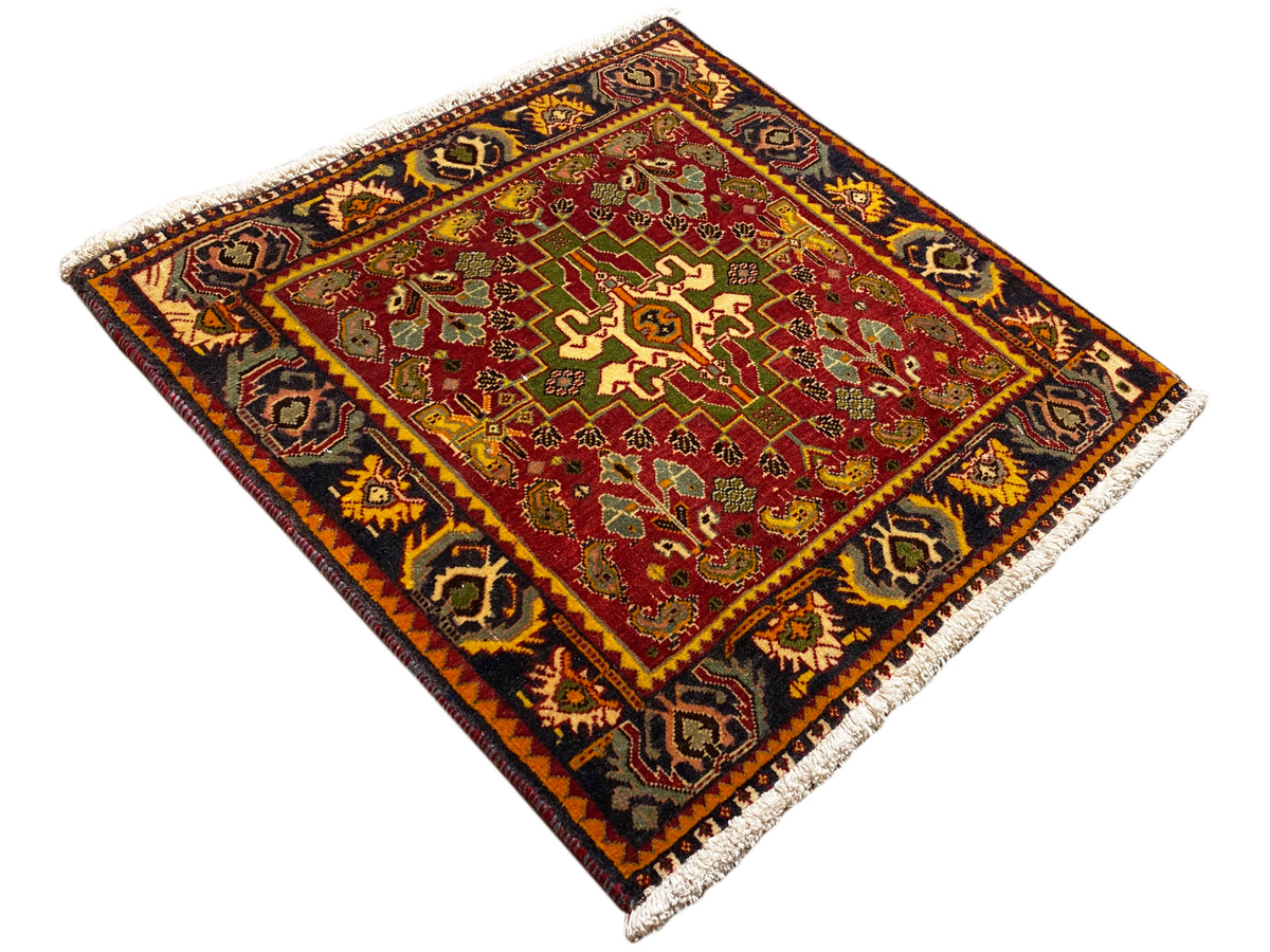Carpet diagonally, red patterned field with green ornaments and a dark decorative border