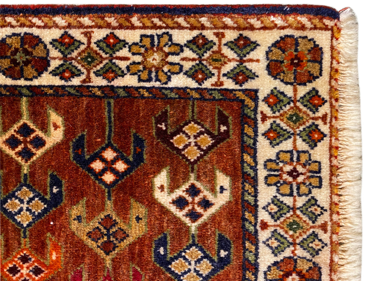 Poshti rug 60x55 cm Detail: ornamental band and central diamonds in reddish brown