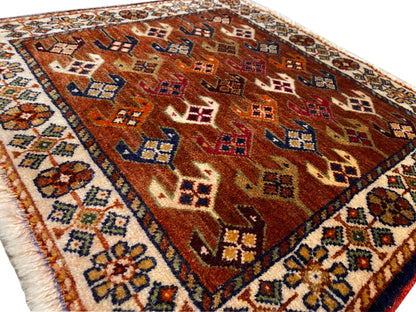 Poshti rug 60x55 cm detail view: brown field with colorful diamonds and tiles