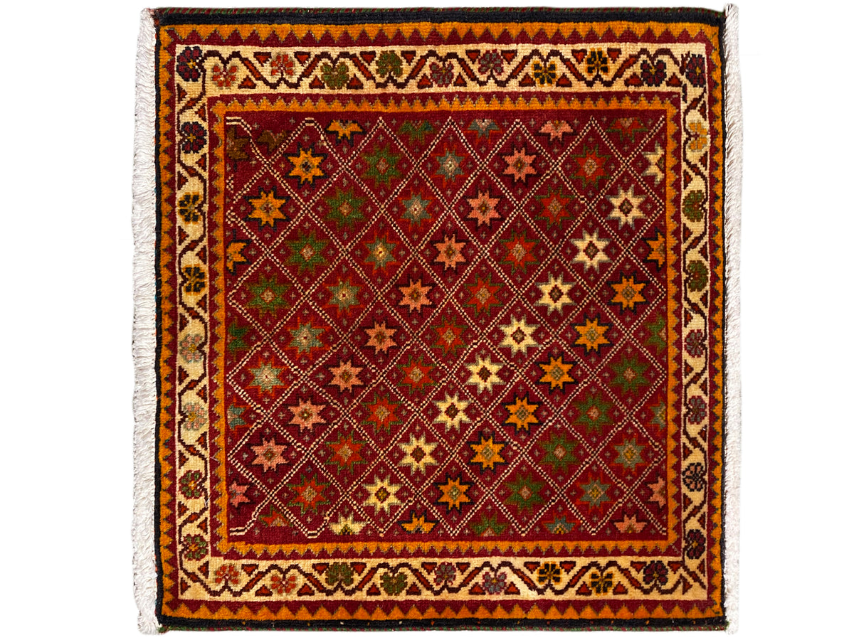 Poshti rug, rectangular, colorful decoration with star and diamond patterns in the central field.