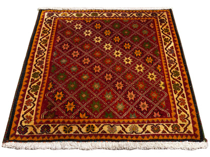 Poshti rug, rectangular, multicolored, with decorative border and fringes along the edges.