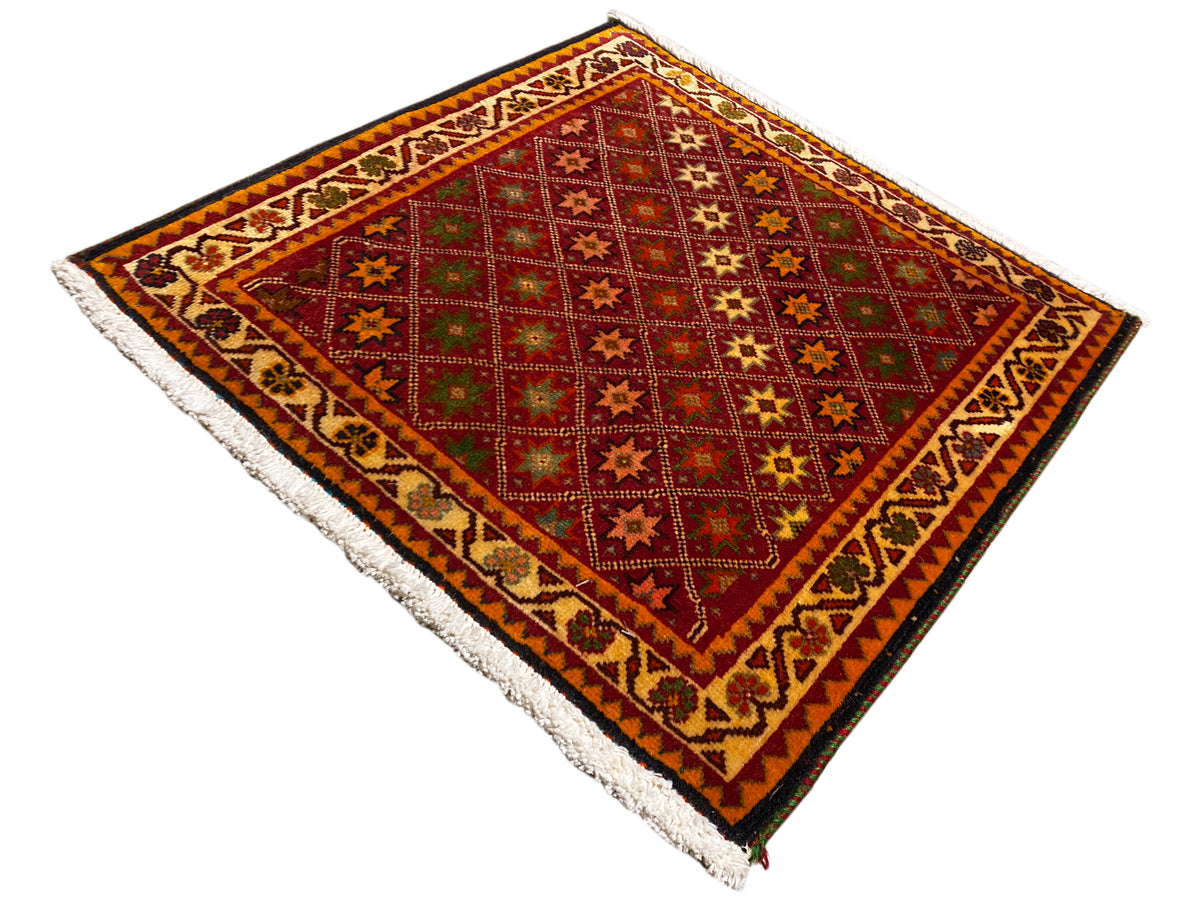 Poshti rug, rectangular: multicolored pattern with decorative stripes and fringes at the corner.