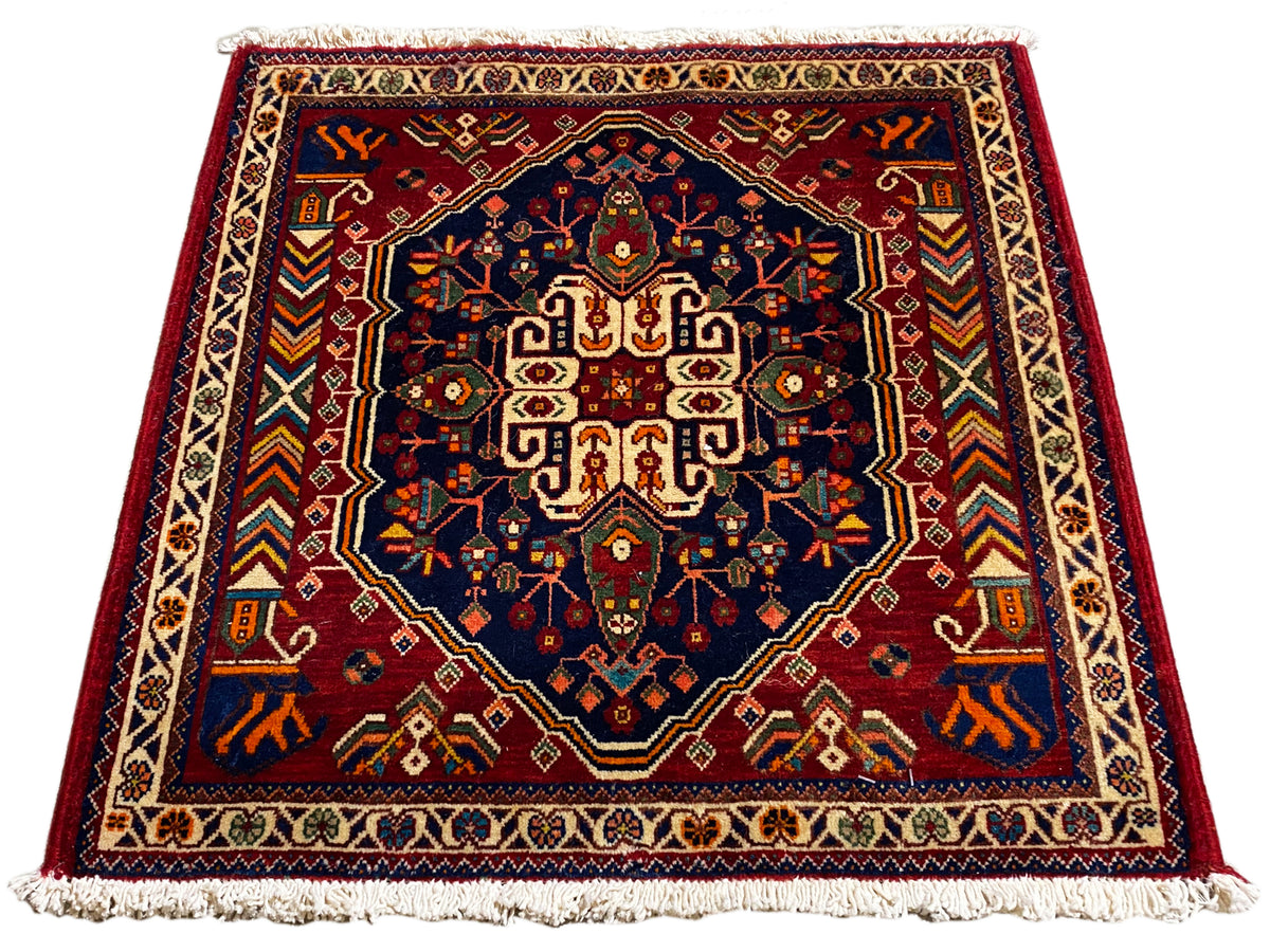 Carpet 63x60 cm, rectangular, dark blue center with a colorful ornamental border