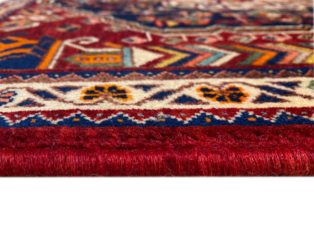 Carpet 63x60 cm Detail: bound edge with red pile and blue-and-white border