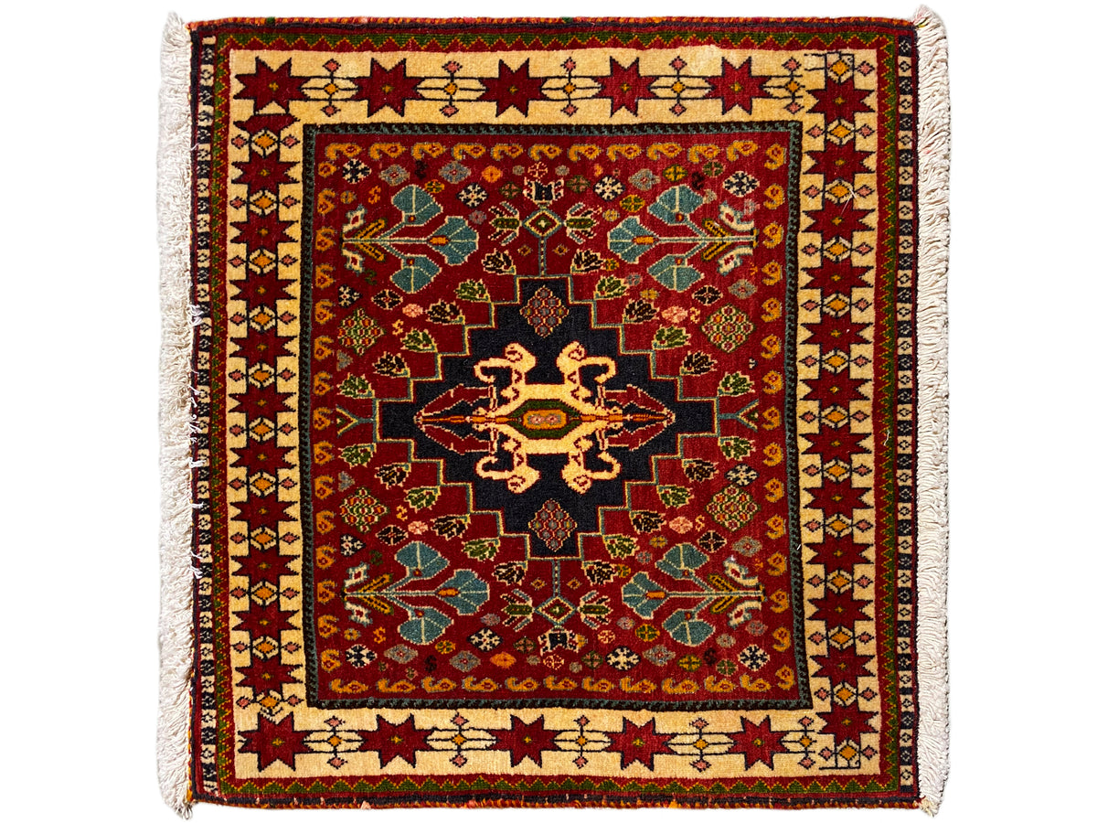 Rug 60x58 cm: red ornament, black center, colored border, fringes