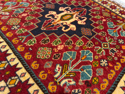 Carpet detail: black medallion with yellow patterns and colorful ornaments