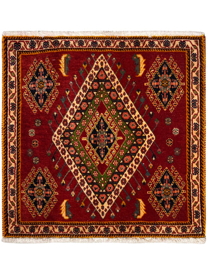Poshti rug with a red background, geometric diamond pattern, and decorative border