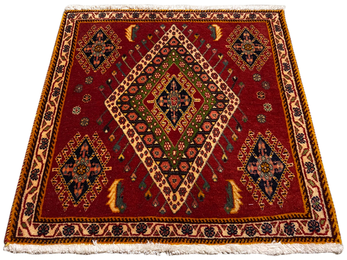 Poshti rug with red flat weave and diamond pattern, framed by borders
