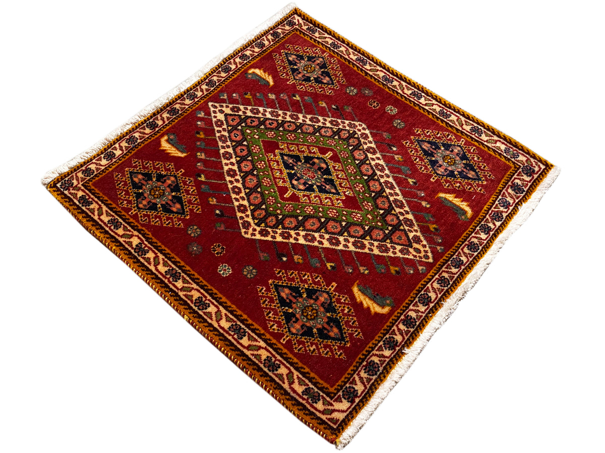 Square-format Poshti rug with a red background and central medallion
