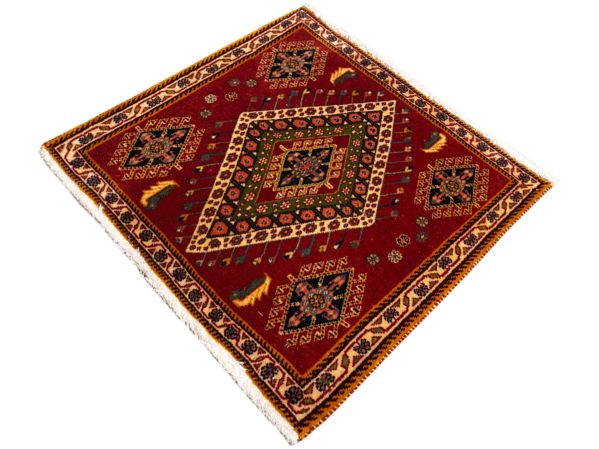 Poshti rug with a red ground, central medallion, and patterned border