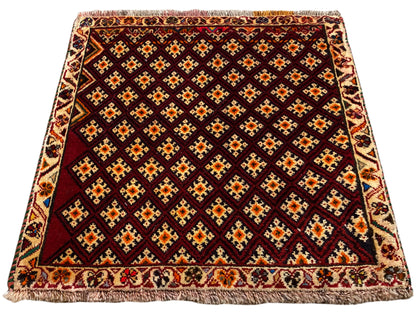 Poshti rug 61x59 cm: dark red rug with a diamond pattern and an all-around fringed edge