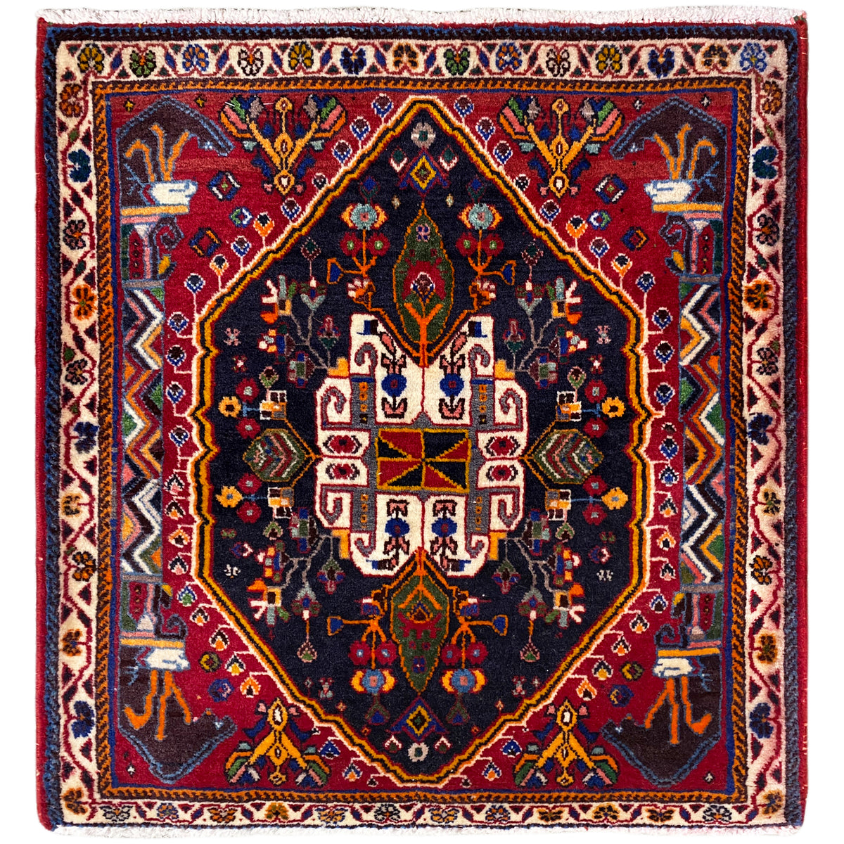 Square rug with a dark blue background, red border, and ornamental pattern, 70x67 cm