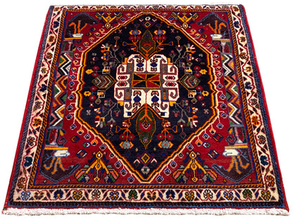 Rug 70x67 cm with a dark blue background, red border, and symmetrical medallion pattern