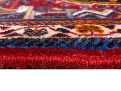 Carpet detail with short pile and red underside, visible patterned stripes