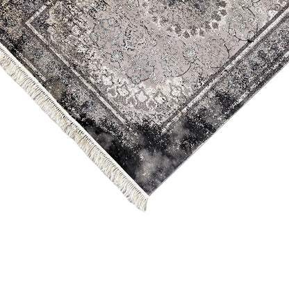 Grauer Wohnzimmerteppich, schwarze Used-Akzente, pflegeleichtes Polypropylen, moderne Wohndeko.