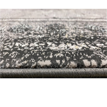 Grau-schwarzer Polypropylen Teppich, maschinengewebt für Langlebigkeit, klassisches Medaillon-Design.