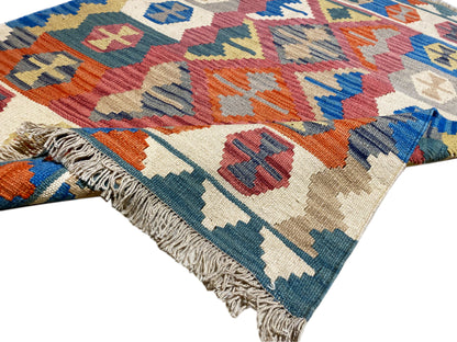 Handgewebter Woll-Kelim Teppich in Blau mit bunten Ornamenten